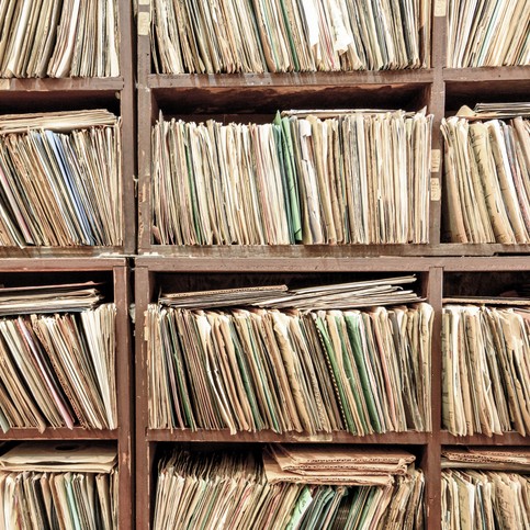 archive of papers stacked on each other.