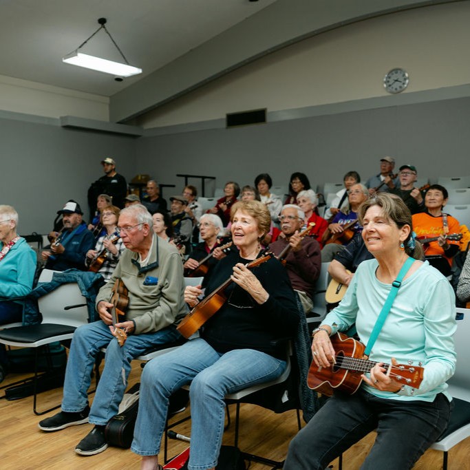 RWC Clubs Square A group of people play guitar and sing